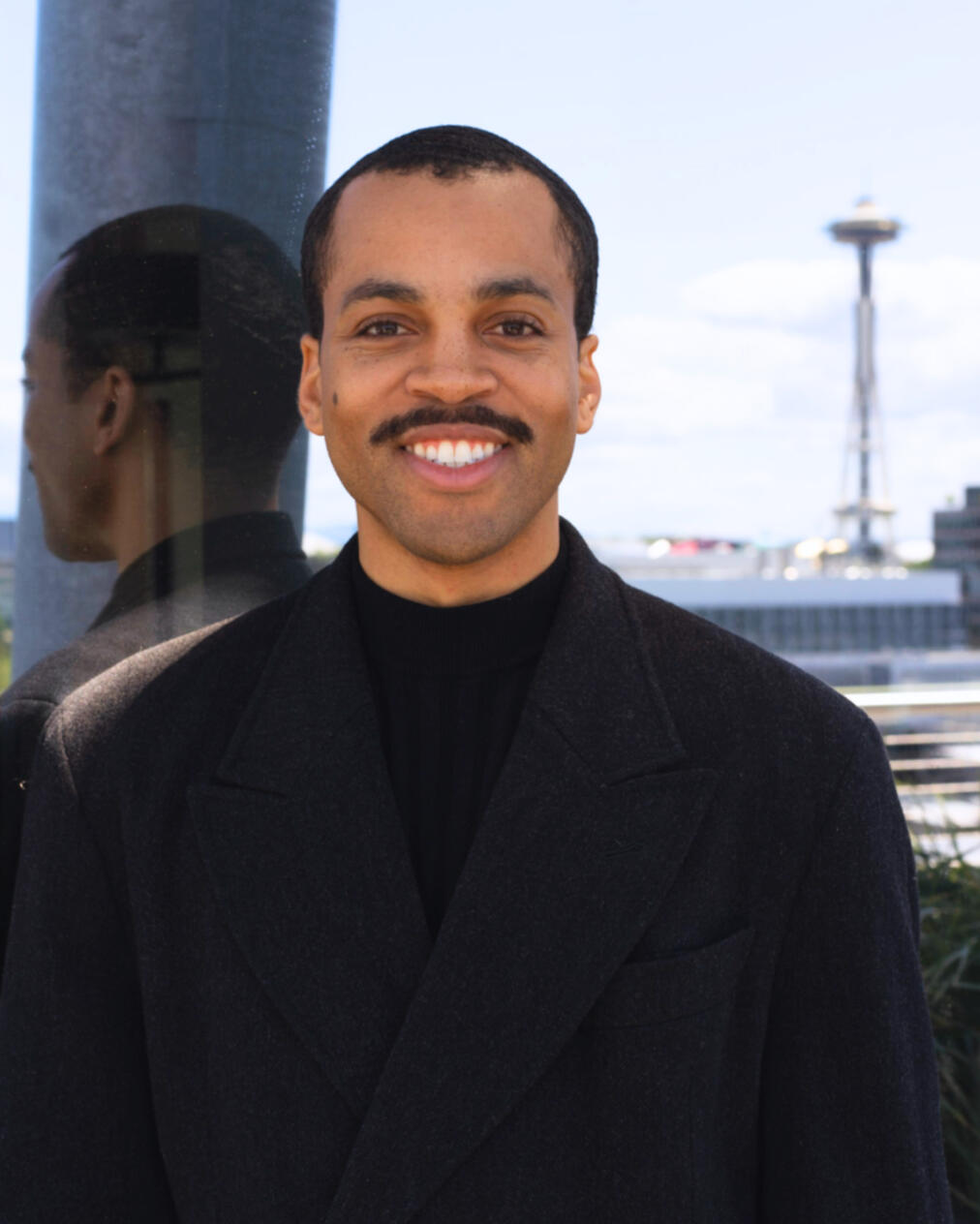 Bryan_Alston_Most_AI_Marketing_Operating_System_of_Tomorrow_Headshot_Outdoor_Space_Needle_Seattle_Black_Blazer_Smiling